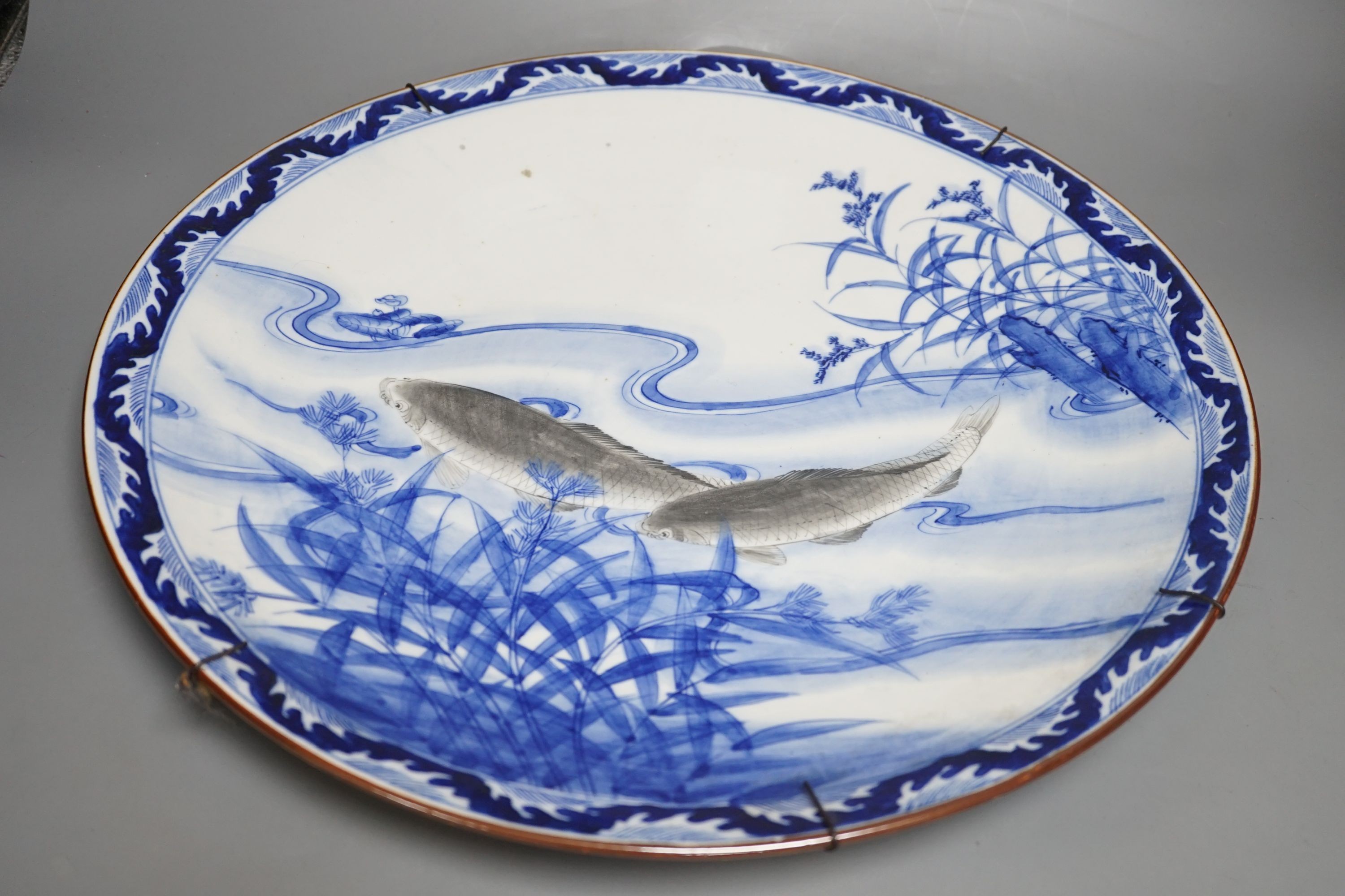 A Japanese porcelain ‘fish’ charger, 46cm